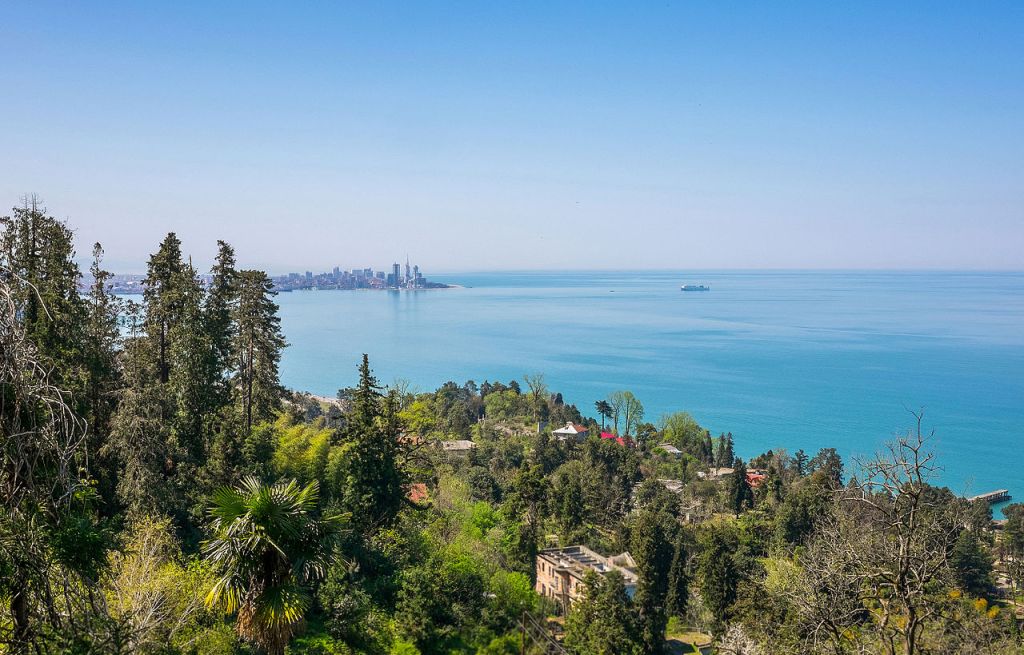 Black Sea coast of Georgia country with skyline of Batumi on the horizon